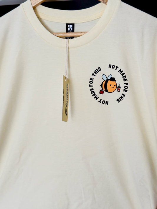 Butter Yellow T-shirt with a bee graphic and text on a hanger