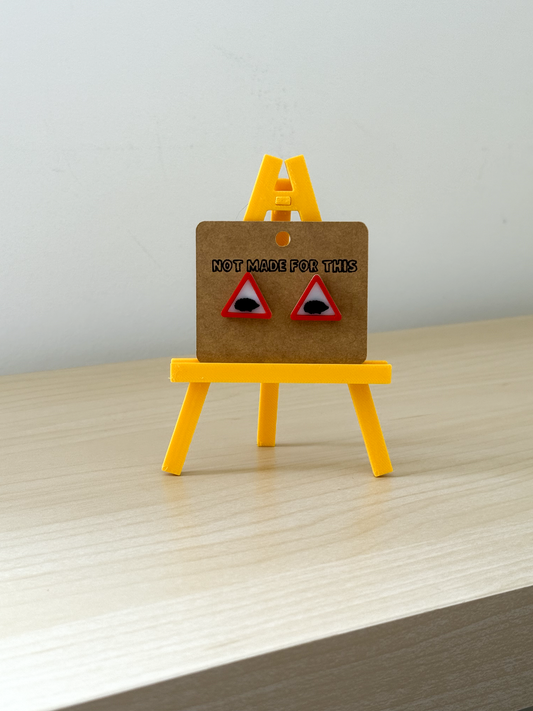 Not Made For This Earring card with earrings on a small yellow easel against a light gray background